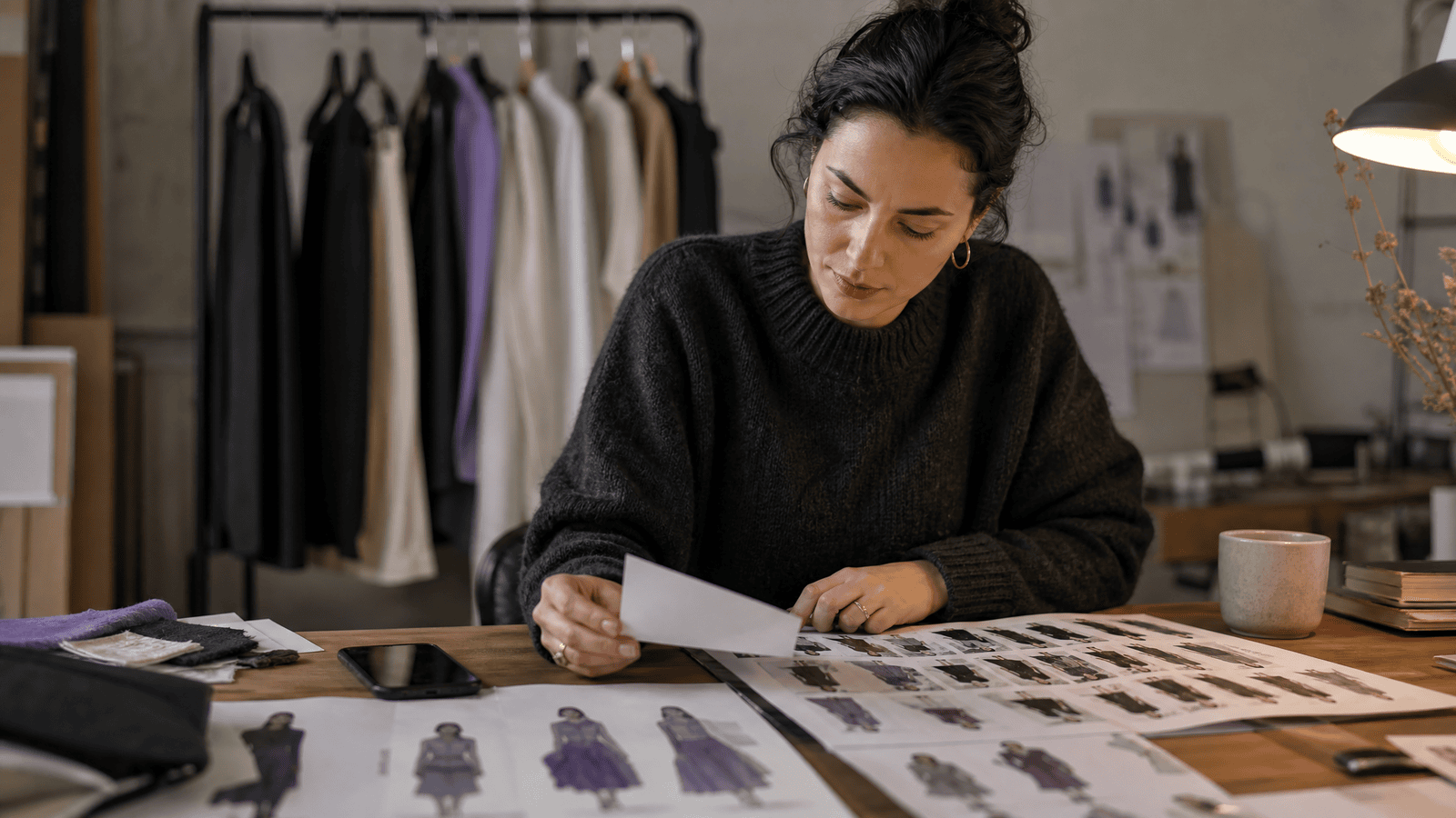 A virtual fashion creator reviewing contact sheets for an Instagram portfolio