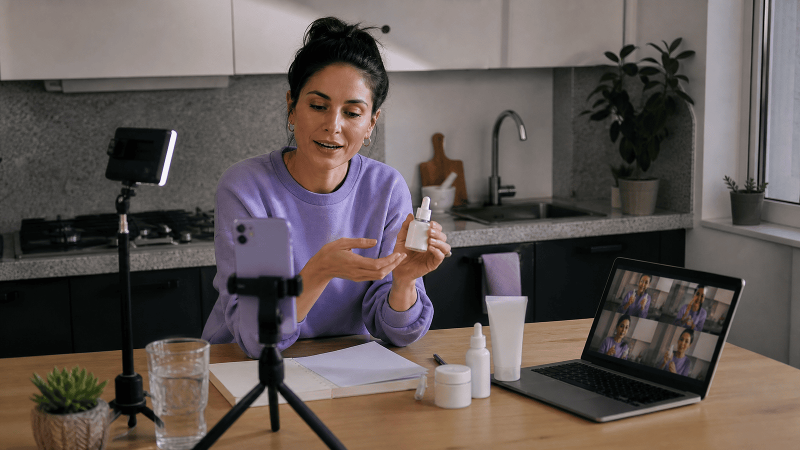 A small UGC-style product shoot in an ordinary kitchen with a phone, cue cards, and alternate takes