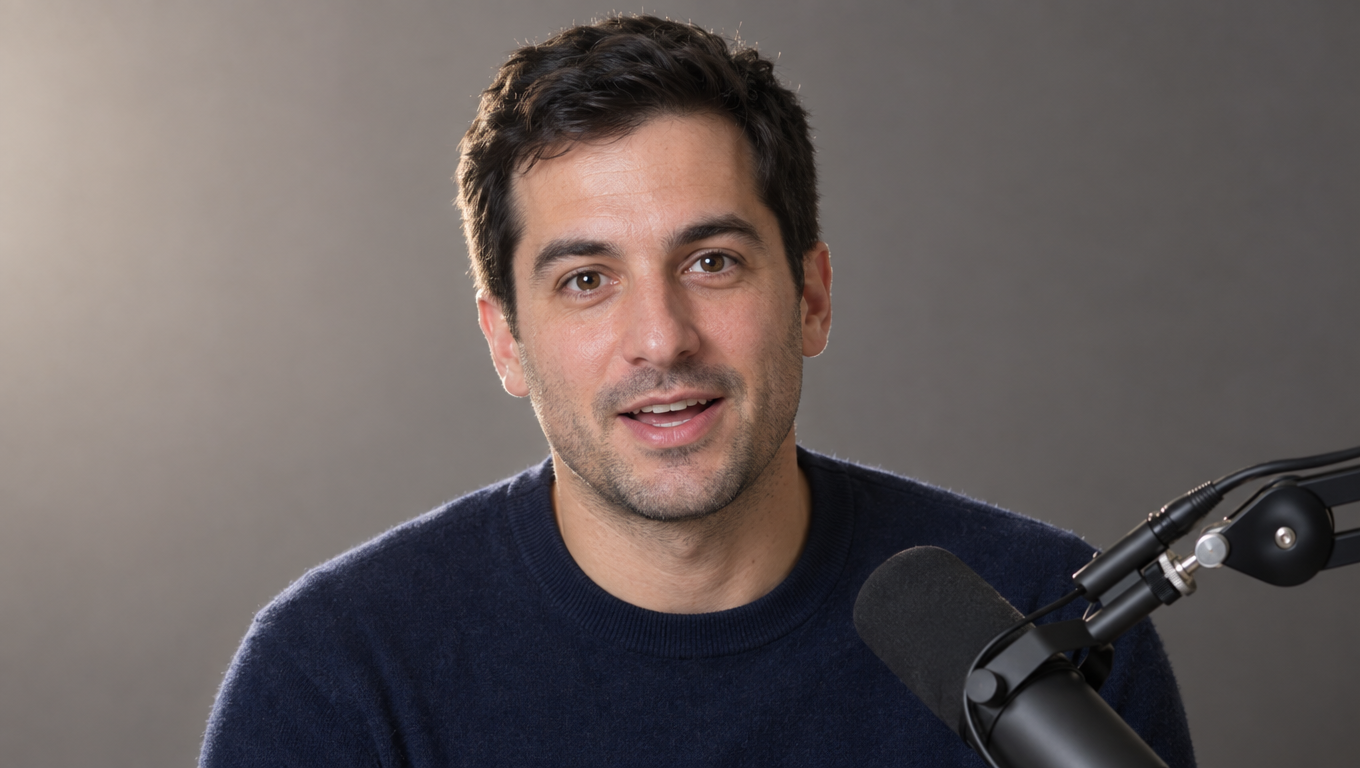 A front-facing adult presenter portrait in soft studio light beside a studio microphone, the kind of clean reference photo a talking avatar model needs